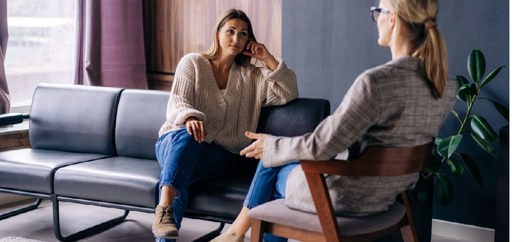 Two female medical professionals discussing Practice Management