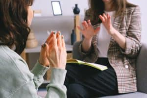 Outpatient psychiatrist talking to patient